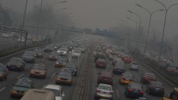 Traffic on the second ring road as heavy air pollution continues to shroud Beijing on February 26, 2014. Beijing's official reading for PM 2.5, small airborne particles which easily penetrate the lungs and have been linked to hundreds of thousands of premature deaths, stood at 501 micrograms per cubic metre. AFP PHOTO/Mark RALSTONMARK RALSTON/AFP/Getty Images