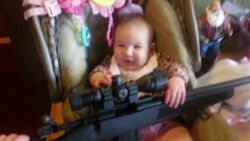 dnt ct imiage of baby holding gun_00000523.jpg