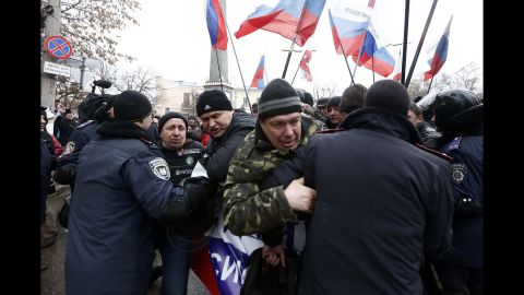Police intervene as Russian supporters gather in front of the parliament building in Simferopol on February 27.