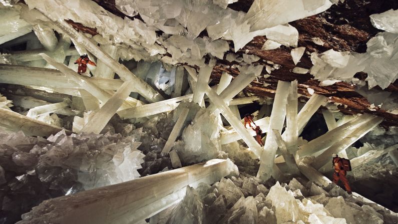 Massive beams of selenite dwarf explorers in the Cave of Crystals.