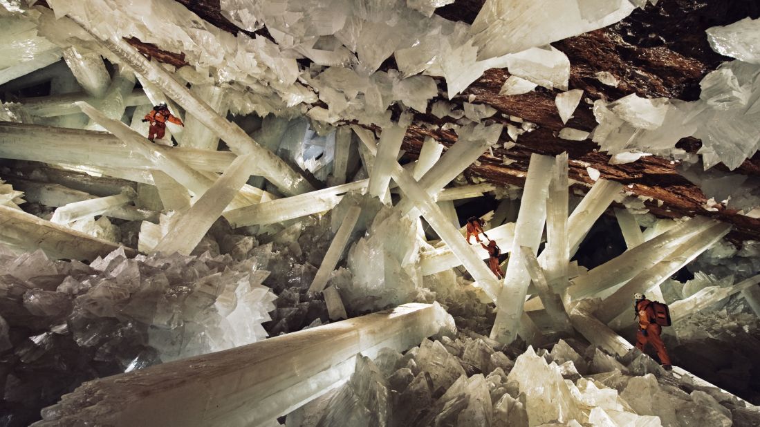 Massive beams of selenite dwarf explorers in the Cave of Crystals.