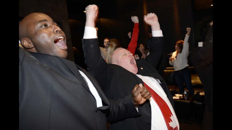 Toronto Mayor Rob Ford, right, celebrates as he watches the televised broadcast of Canada's Olympic win over the United States in the men's hockey semifinals Friday, February 21. Canada went on to <a href="http://www.cnn.com/2014/02/23/sport/olympics-sochi-canada-final-day/index.html">win the gold medal</a>.