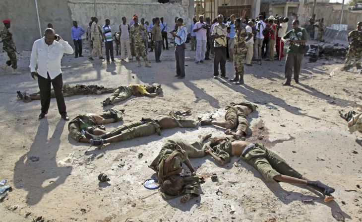 Dead bodies of militants are seen on the ground after they carried out <a href="http://www.cnn.com/2014/02/21/world/africa/somalia-attack/index.html">an attack on Somalia's presidential palace</a> Friday, February 21, officials and eyewitnesses said. Terror network Al-Shabaab, al Qaeda's affiliate in Somalia, claimed responsibility for the attack that killed at least 12 people, seven of them militants, Somalia's national security minister said.
