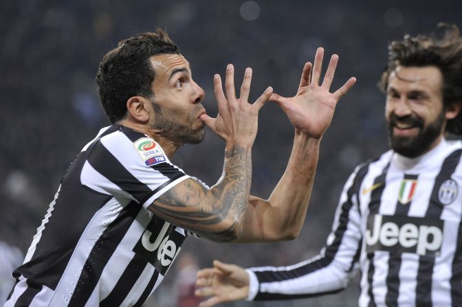 Juventus striker Carlos Tevez, left, celebrates with teammate Andrea Pirlo after scoring against Torino during a Serie A soccer match in Turin, Italy, on Sunday, February 23.