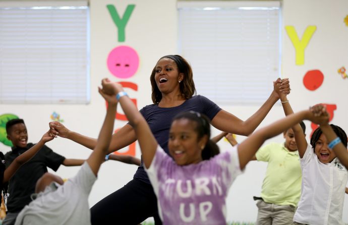 First lady Michelle Obama participates in a yoga class with children in Miami on Tuesday, February 25. This week marked the fourth anniversary of her Let's Move campaign, which fights childhood obesity.