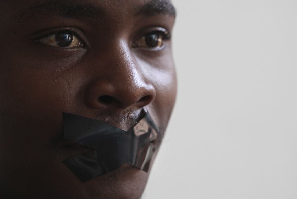FEBRUARY 27 - JOHANNESBURG, SOUTH AFRICA: Television employee Zixolisile Mtebele protests against the December arrest of a team of Al Jezeera journalists in Egypt. The journalists remain in police custody along with 17 others. They have been charged with aiding or joining a terrorist group and are currently standing trial.