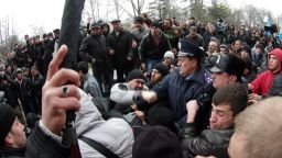 Ukrainian activists clash with pro-Russian activists as policemen try to separate in front of Crimean regional parliament in Simferopol on February 26, 2014. Pro-Russian demonstrators on Wednesday brawled with supporters of Ukraine's interim authorities in the capital of the Russophone Crimea region Simferopol, an AFP reporter at the scene said. Scuffles erupted as thousands of pro-Moscow residents and Muslim Crimean Tatars backing the new leadership in Kiev held competing rallies outside the regional parliament building, where local legislators rejected demands to debate splitting from Kiev. AFP PHOTO/ VASILIY BATANOV (Photo credit should read Vasiliy BATANOV/AFP/Getty Images)