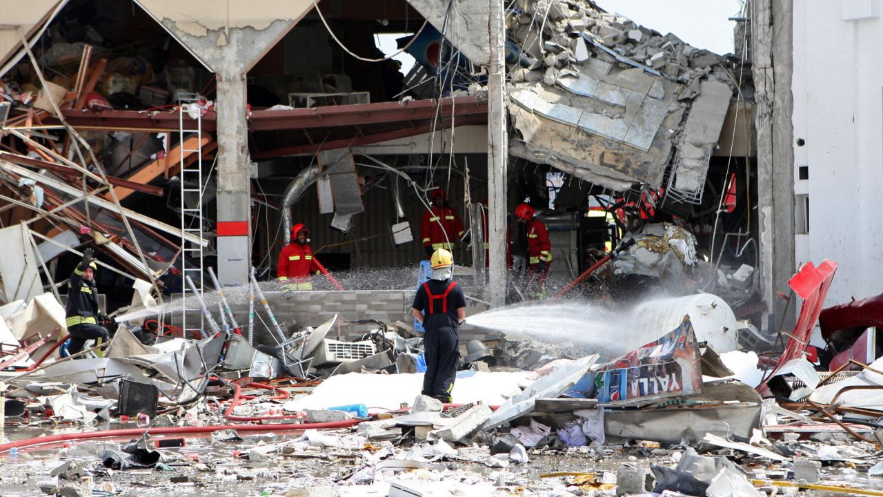 Firemen work at the site of an explosion in Doha, Qatar on February  27, 2014. 