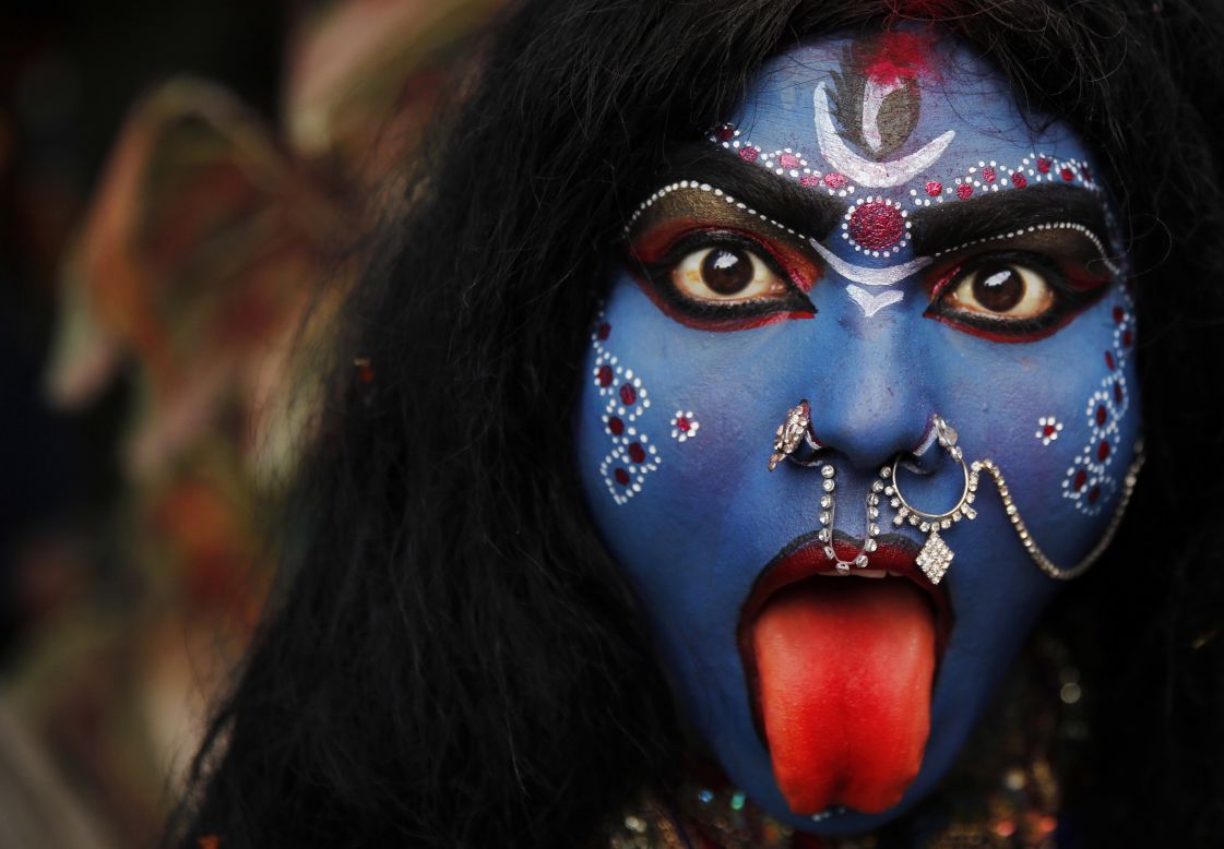 FEBRUARY 28 - ALLAHABAD, INDIA: A woman dressed as Hindu goddess Kali participates in a Shivaratri procession. The night is dedicated to the worship of Lord Shiva, the Hindu god of death and destruction. Kali is represented as the consort of Shiva.