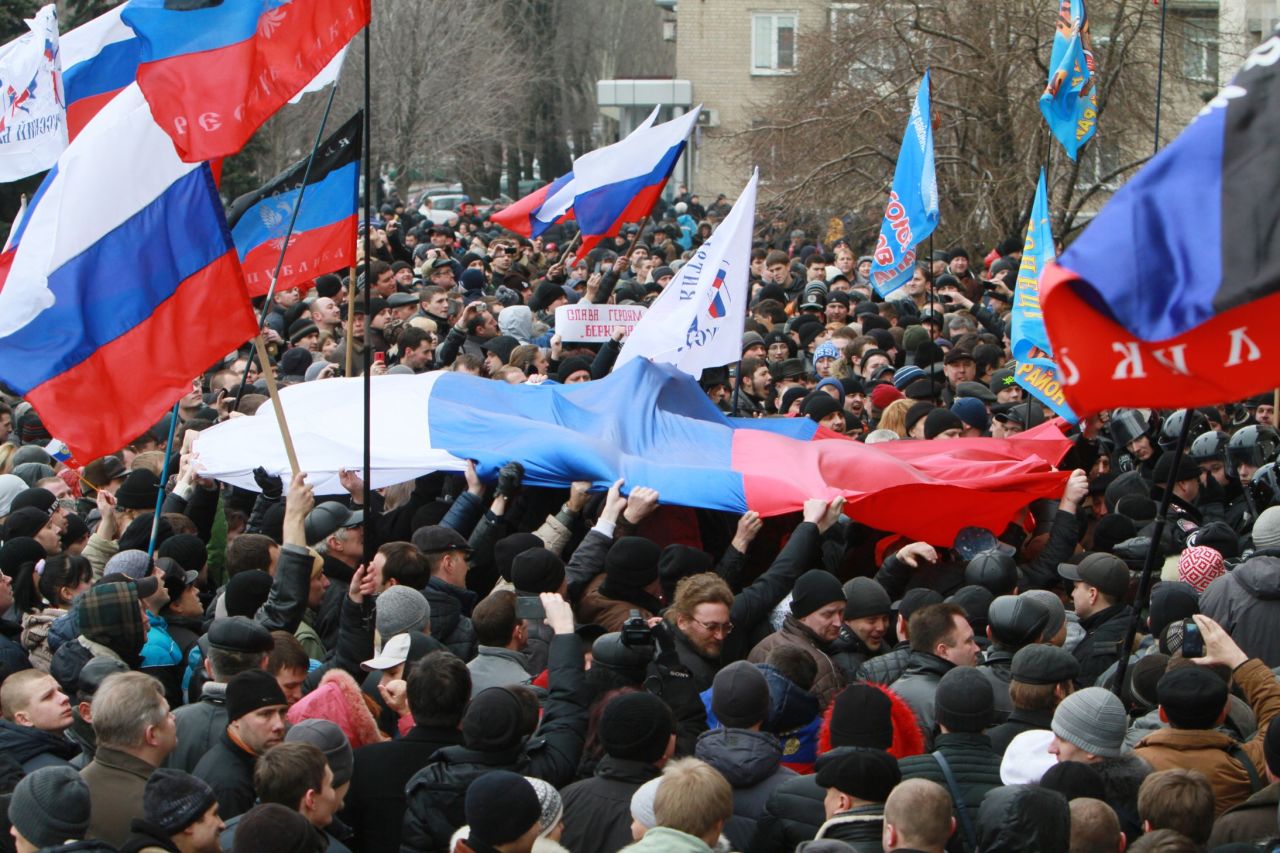 Pro-Russian activists hold Russian flags during a rally in the center of Donetsk on March 1.