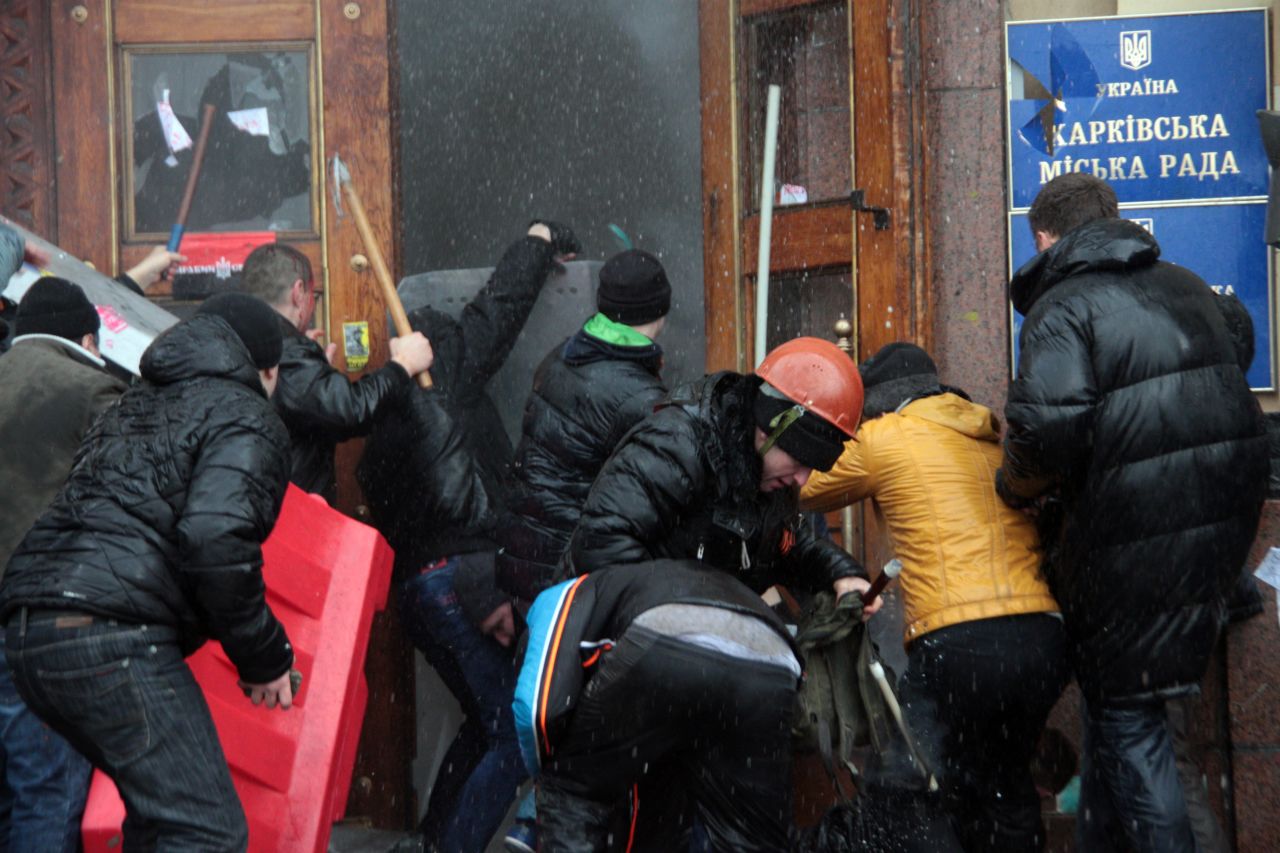 Pro-Russian activists clash with Maidan supporters as they storm the regional government building in Kharkiv, Ukraine, on March 1.