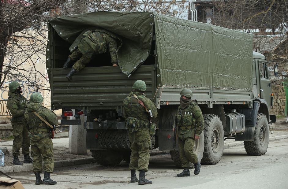 Heavily armed soldiers displaying no identifying insignia maintain watch in Simferopol on March 1.