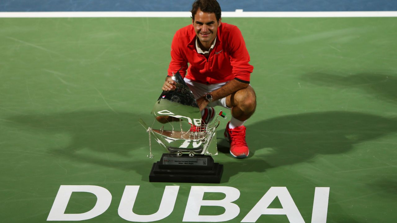 Roger Federer poses for photographers after clinching a sixth Dubai title on Saturday. 