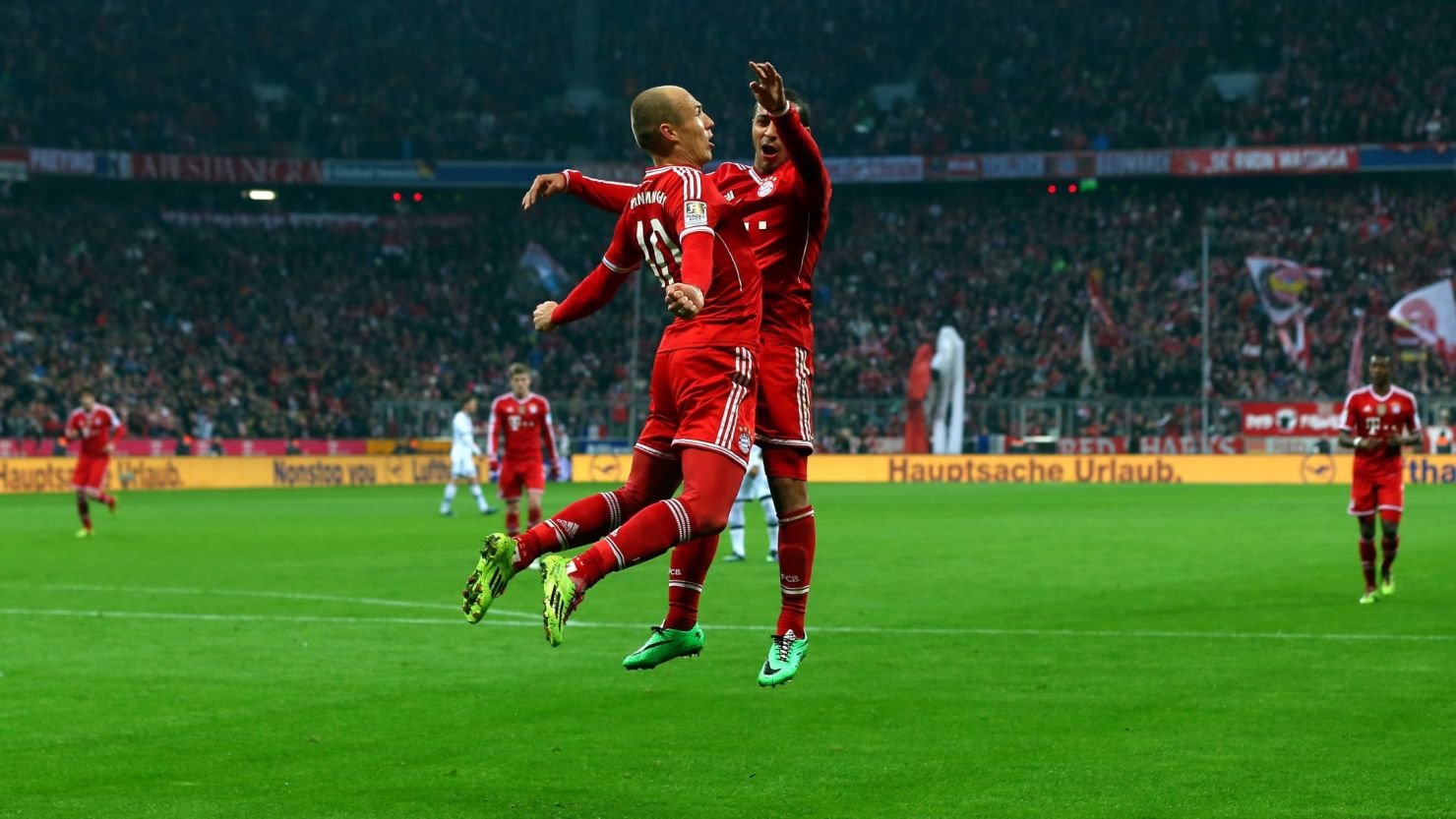 Arjen Robben (left) celebrates team mate Thiago during the 5-1 win over Schalke on Saturday. 