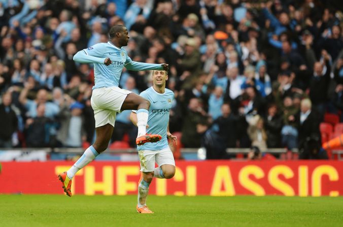 Yaya Toure punches the air in celebration after scoring Manchester City's equalizer at Wembley.