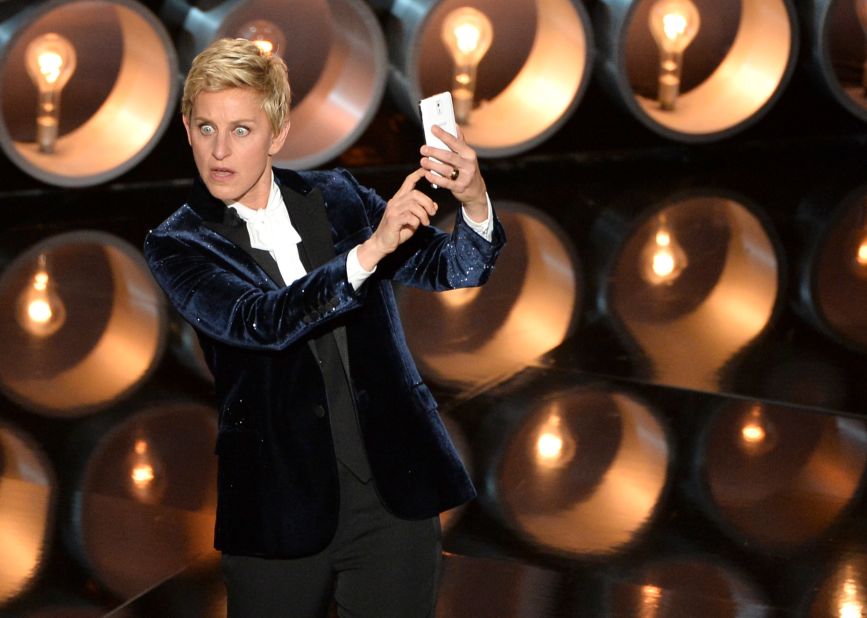DeGeneres <a href="https://twitter.com/TheEllenShow/status/440302561044594688" target="_blank" target="_blank">takes a selfie</a> on stage near the start of the show.
