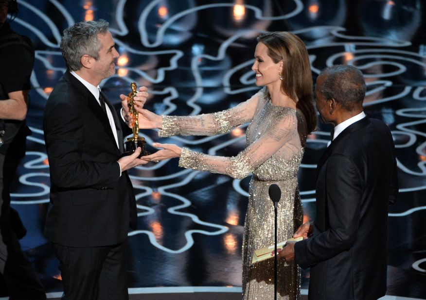 Angelina Jolie and Sidney Poitier present Alfonso Cuaron with the best director Oscar for "Gravity."