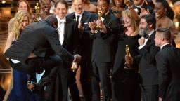 Director Steve McQueen, left, celebrates with the cast and crew of "12 Years a Slave" as they accept the Academy Award for best picture on Sunday, March 2.