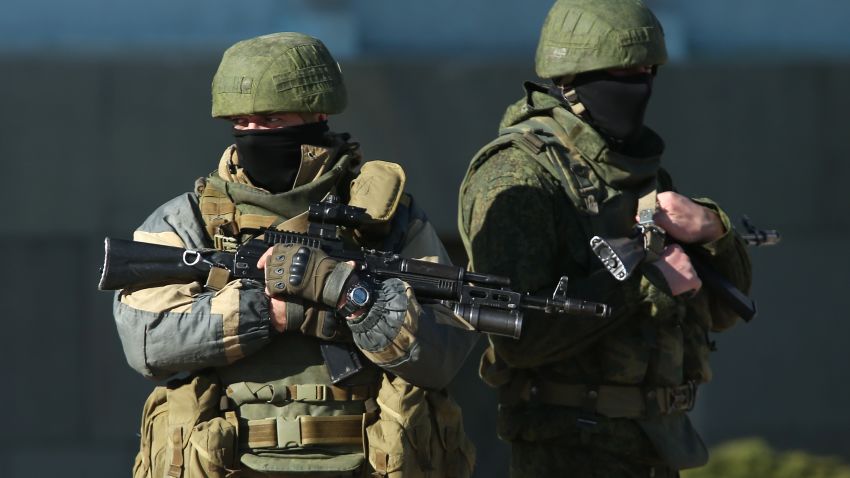 Heavily-armed troops displaying no identifying insignia and who were mingling with local pro-Russian militants stand guard outside a local government building on March 3, 2014 in Simferopol, Ukraine.