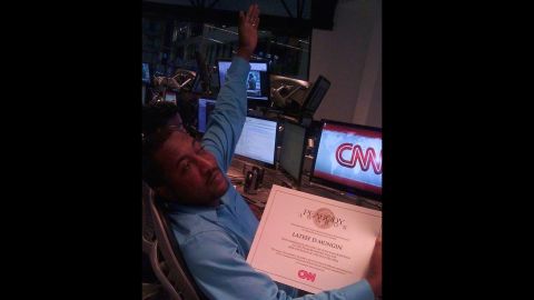 Mungin shows off his Peabody Award certificate for CNN's coverage of the Gulf oil spill in 2009.