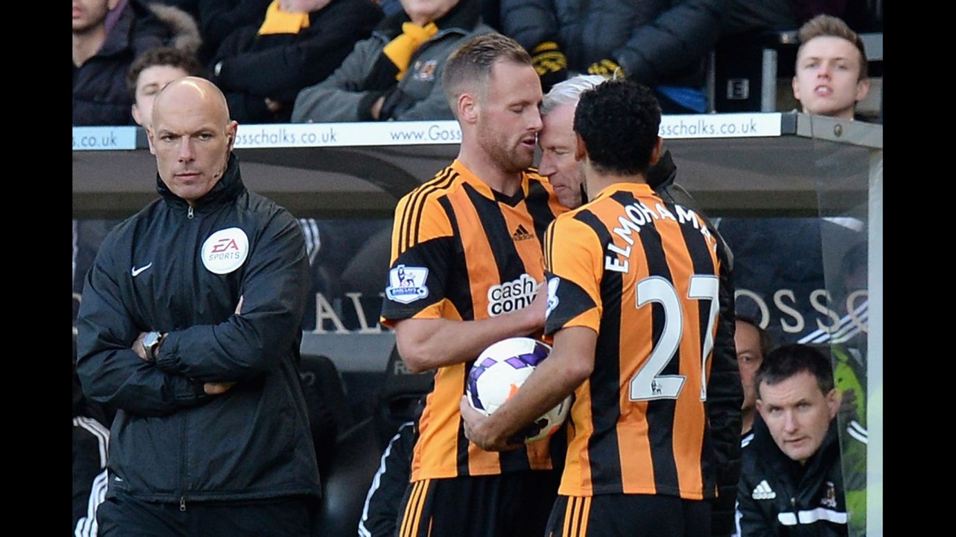 Alan Pardew, the manager of Newcastle United, headbutts Hull City's David Meyler during an English Premier League match Saturday, March 1, in Hull, England. Pardew was fined by his team and later charged by the Football Association for improper conduct.