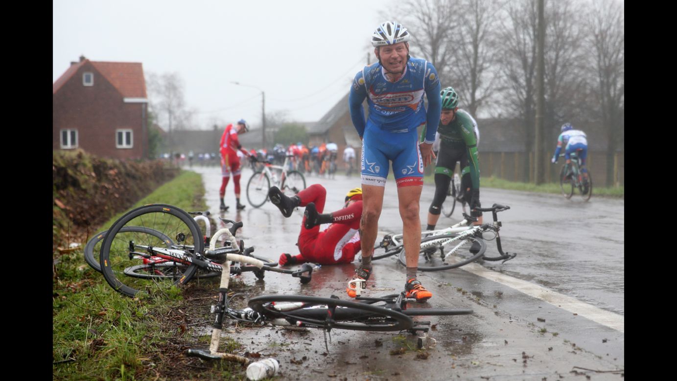 Laurens De Vreese, foreground, recovers after a crash during the Omloop Het Nieuwsblad in Ghent, Belgium, on Saturday, March 1.