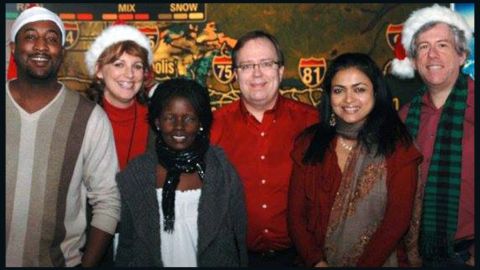 Mungin, left, poses with colleagues on the overnight shift at The CNN Wire at Christmas 2009.
