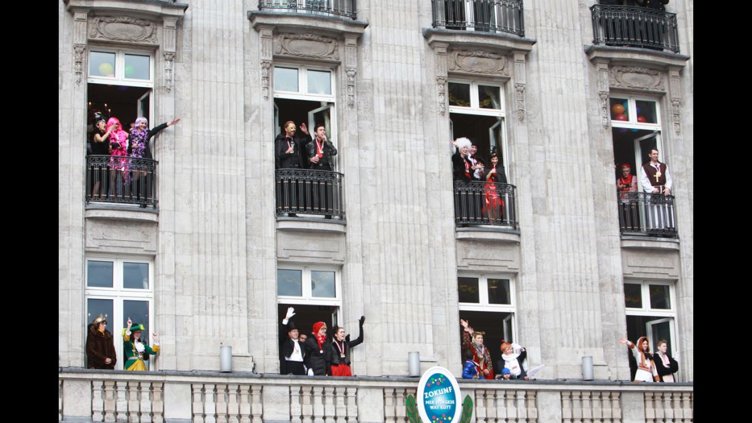 A costumed audience watches the Cologne parade from balconies on March 3.