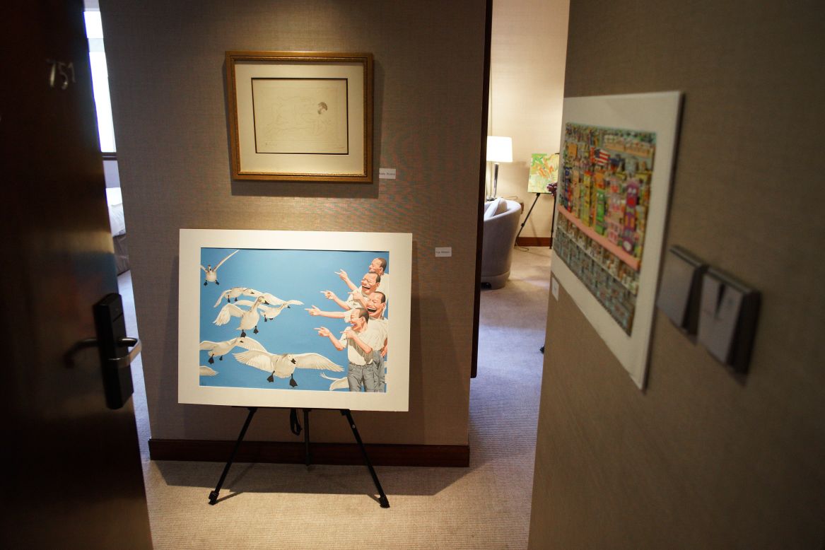 Yue Minjun's "Big Swan" oil painting greeted visitors in room 751 at the Marco Polo Hongkong Hotel. Above the contemporary work is an original sketch by Pablo Picasso.