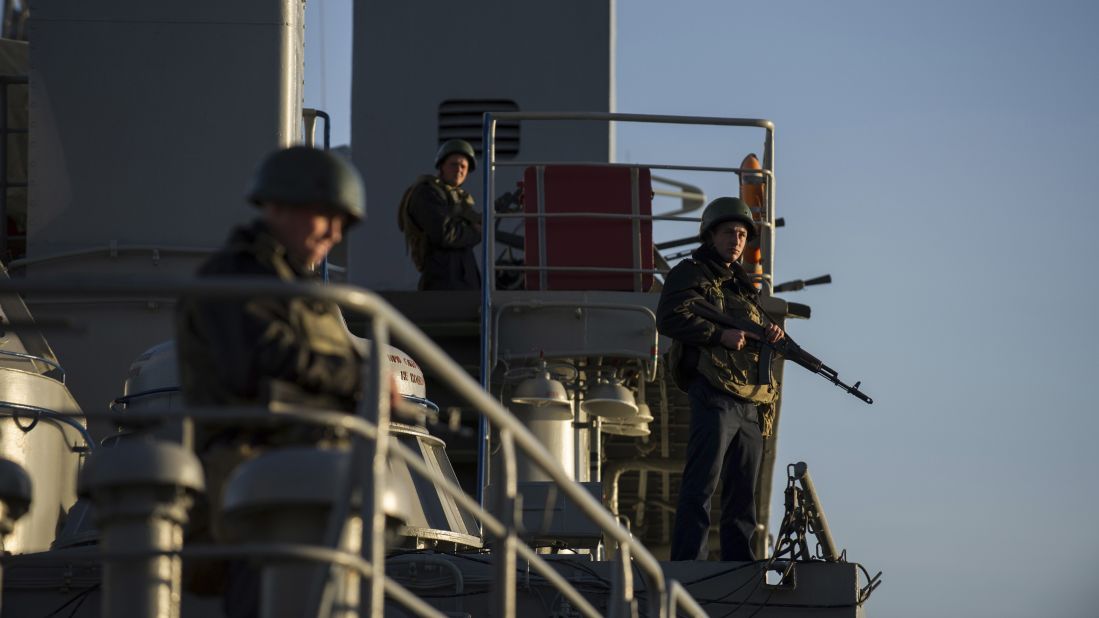 Ukrainian seamen stand guard on the Ukrainian navy ship Slavutych in the Sevastopol harbor on Monday, March 3.