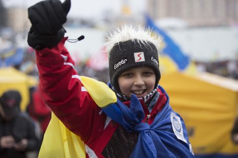 A young Ukrainian boy cheers in support of his country. 