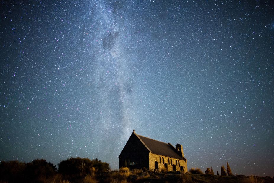 <strong>Aoraki Mackenzie Dark Sky Reserve (New Zealand):</strong> Looking south from Lake Tekapo, on the South Island in New Zealand, you can see the Milky Way stretching over the Church of the Good Shepherd. The Southern Cross and the Coal Sack Nebula are visible near the top of the image. 