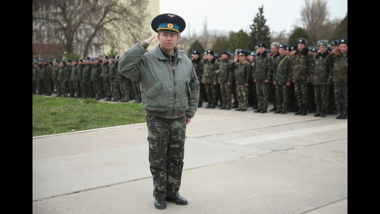 Yuli Mamchun, the commander of the Ukrainian military garrison at the Belbek air base near Sevastopol, salutes on March 4.
