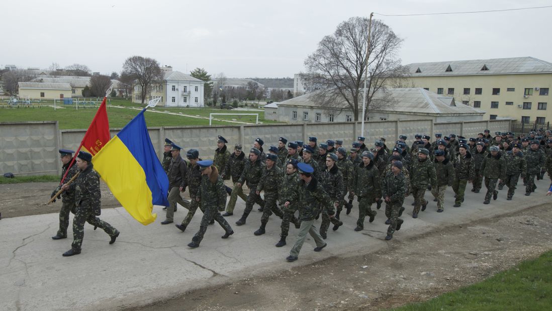 Ukrainian military members march at the Belbek air base on March 4.