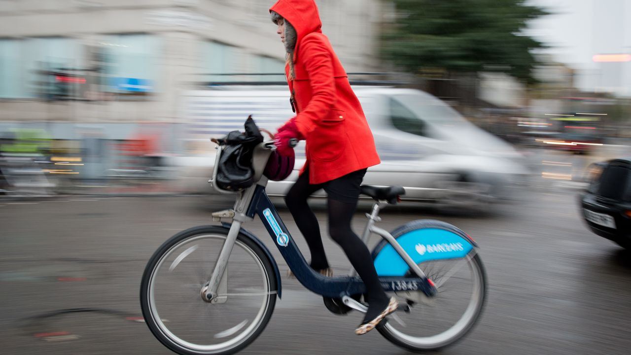 A cyclist rides a public hire "Boris Bike" in central London, November 2013. 