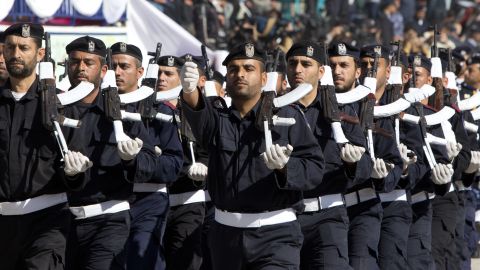 Palestinian Hamas policemen march during a graduation ceremony in Gaza City on January 29, 2014.