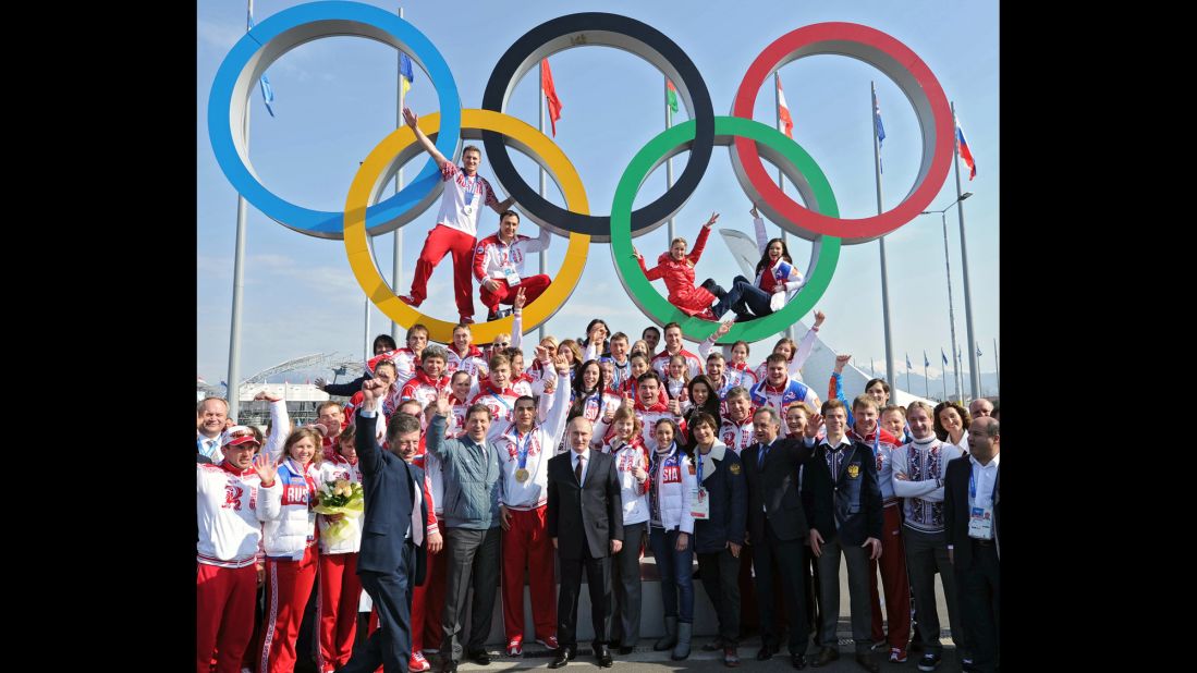 Putin poses for a photo with Russian Olympic athletes in Sochi, Russia, in February 2014. Russia hosted the Winter Olympic Games and won the most medals.