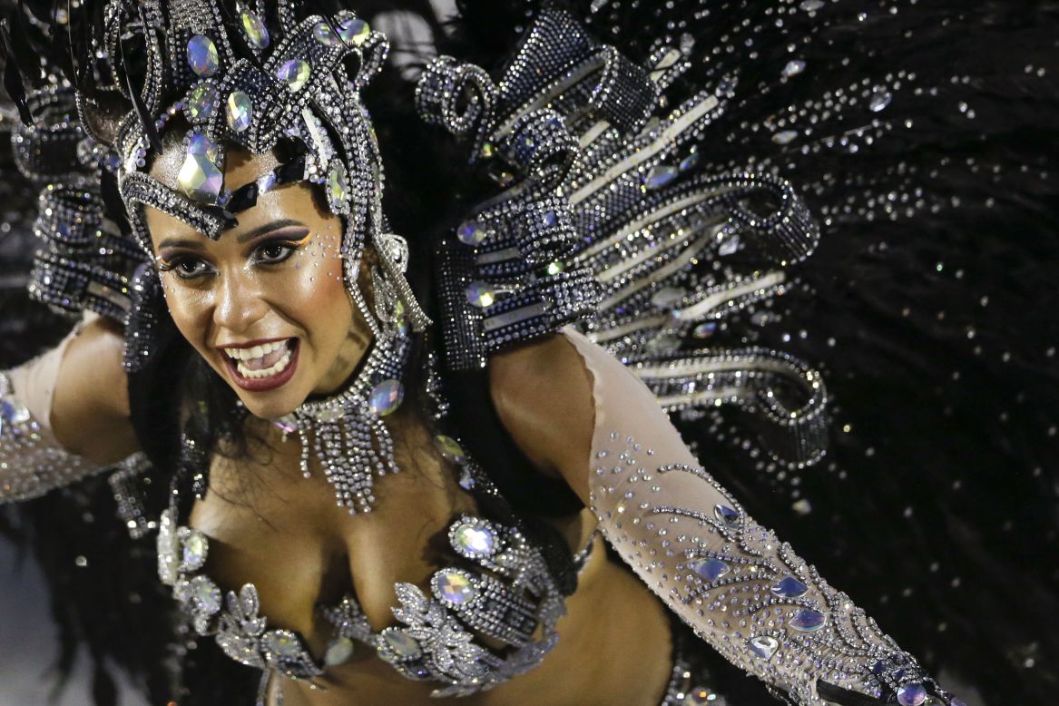 MARCH 4 - RIO DE JANEIRO, BRAZIL: A performer from the Beija-Flor samba school parades during carnival celebrations at the Sambadrome -- a competition between dance schools -- on March 3. <a href="http://cnn.com/video/data/2.0/video/world/2014/03/03/wbt-pkg-darlington-brazil-rio-carnival.cnn.html">Watch as CNN's Shasta Darlington follows the colorful procession. </a>