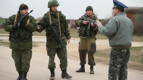 A commander at the Ukrainian military garrison at the Belbek airbase speaks to troops under Russian command occupying the Belbek airbase in Crimea on March 4, 2014 in Lubimovka, Ukraine. 