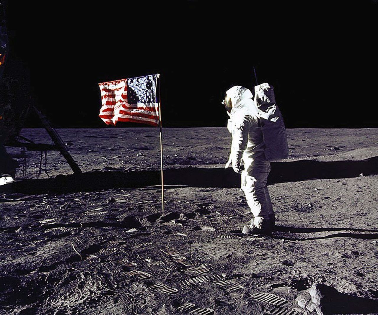 Apollo 11 astronaut Edwin E. "Buzz" Aldrin Jr. salutes the U.S. flag on the lunar surface on July 20, 1969. Aldrin and mission commander Neil Armstrong became the first humans to walk on the moon. Their mission was considered an American victory in the Cold War and subsequent space race, meeting President Kennedy's goal of "landing a man on the moon and returning him safely" before the end of the decade.