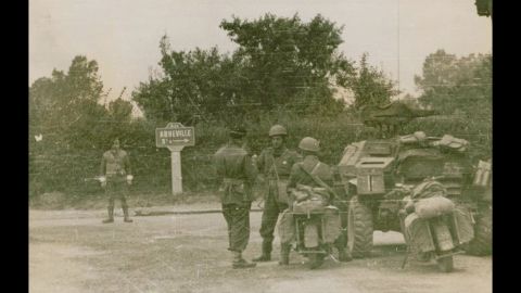 Dionizy Storozynski, third from left, talks with members of his regiment near Abbeville, France.