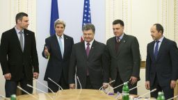 (L to R) Head of the Ukrainian UDAR (PUNCH) party and candidate in Ukraine's early presidential election Vitali Klitschko, US Secretary of State John Kerry, Ukrainian member of parliament and businessman Petro Poroshenko, head of the Ukrainian nationalist Svoboda party Oleh Tyahnybok, and Ukrainian member of parliament for the Regions Party Sergiy Tigipko stand during their meeting in Kiev on March 4, 2014. Kerry became the highest-profile foreign diplomat to visit Ukraine's interim government, offering a $1 billion support package in the face of an escalating crisis with Russia. Kerry accused Russia on March 4 of looking for a "pretext" to invade Ukraine after taking de-facto control of the ex-Soviet state's strategic Crimea peninsula. AFP PHOTO / POOL / KEVIN LAMARQUEKEVIN LAMARQUE/AFP/Getty Images
