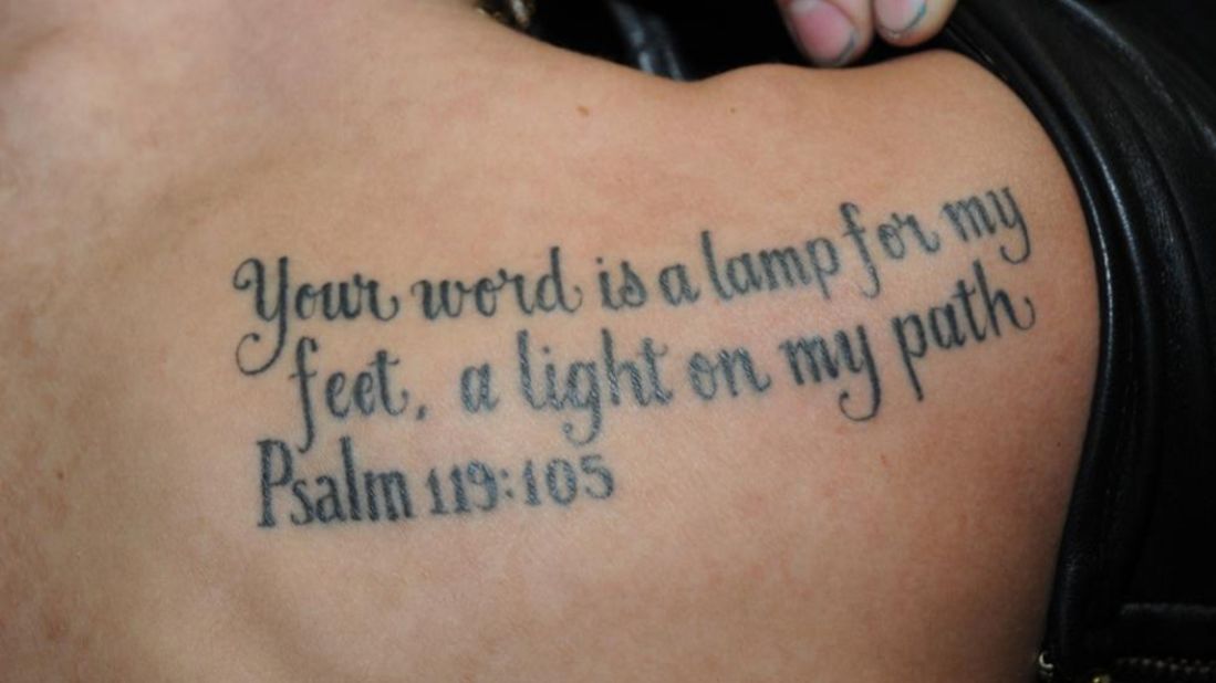 He sports a Bible verse, Psalm 119:105, that reads: "Your word is a lamp for my feet, a light on my path" on his other shoulder blade.