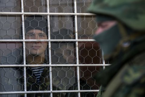A sailor looks out a window near the entrance to the Ukrainian navy headquarters in Sevastopol on March 3.