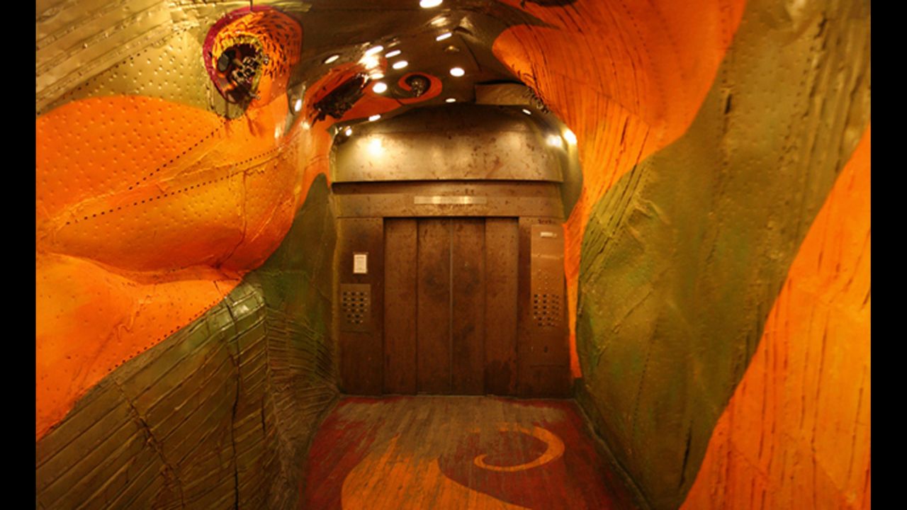 The red dragon painted on the interior of this elevator in the Long Island City Business Center building has 3-D beasts bursting from its eye sockets.