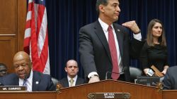 House Oversight and Government Reform Committee Chairman Darrell Issa, right, signals for ranking member Rep. Elijah Cummings'  microphone to be turned off after adjourning a hearing on the IRS targeting scandal.