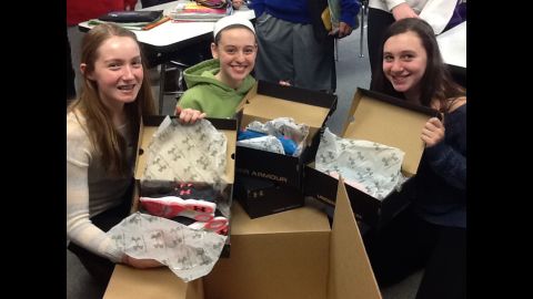 Seventh-graders Emily Born, Lauryn Lintner, Grace Maher, left to right, decided to compare running shoes for their genius hour project, which began in September at Thomas Middle School in Arlington Heights, Illinois. They contacted sports clothing and accessories companies to request samples for testing, and Under Armour sent some in late February. 