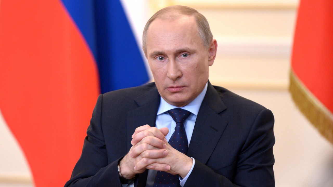 Russian President Vladimir Putin looks on during a press conference in his country residence of Novo-Ogaryova outside Moscow on March 4, 2014.