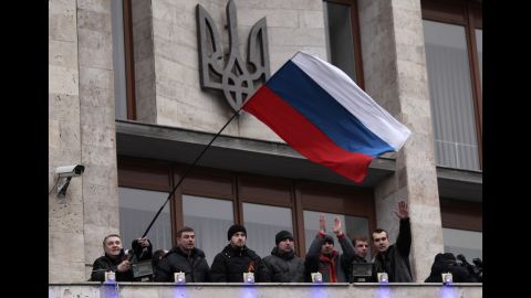 Pro-Russia demonstrators wave a Russian flag after storming a regional administrative building in Donetsk on March 5.