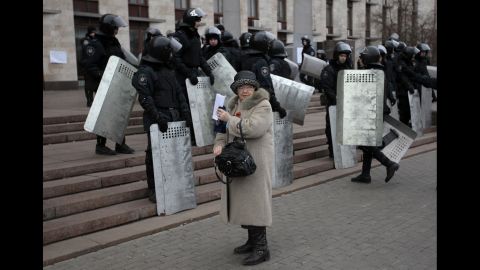 Riot police stand at the entrance of a regional administrative building during a rally in Donetsk on March 5.